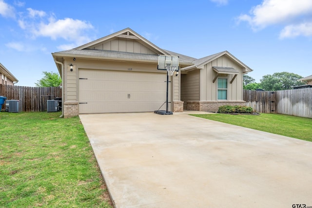 109 Summit Cv, Jacksonville, TX 75766 - view of front of home featuring board and batten siding, brick siding, concrete driveway, and central AC