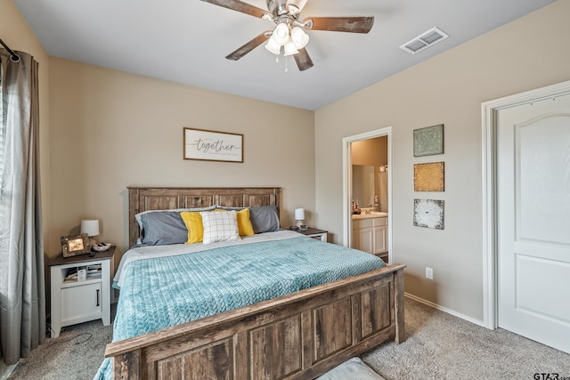 109 Summit Cv, Jacksonville, TX 75766 - bedroom with light carpet, ensuite bath, baseboards, and a ceiling fan