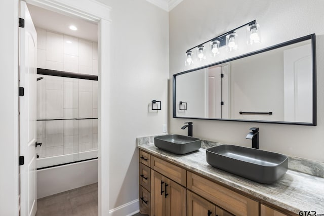 bathroom with vanity and shower / bath combination with glass door