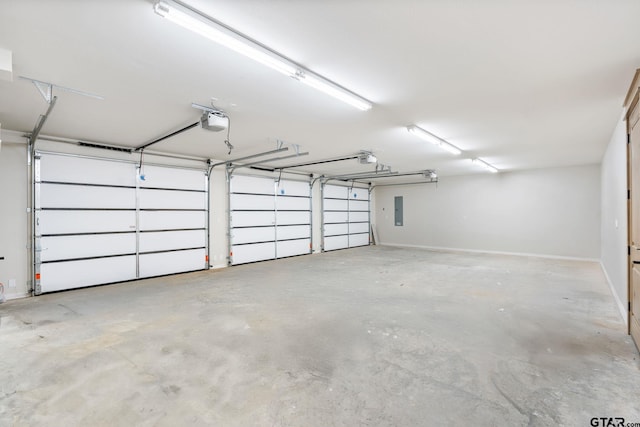 garage with electric panel and a garage door opener