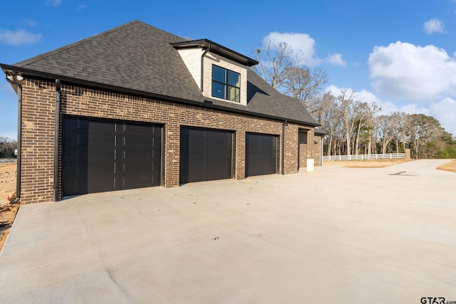 view of property exterior with a garage