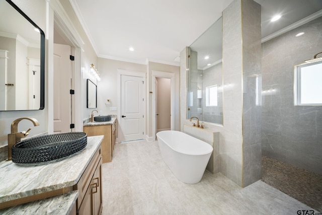 bathroom with separate shower and tub, vanity, and crown molding