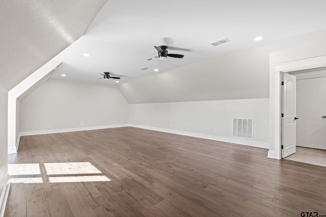 bonus room featuring ceiling fan, lofted ceiling, and dark hardwood / wood-style flooring