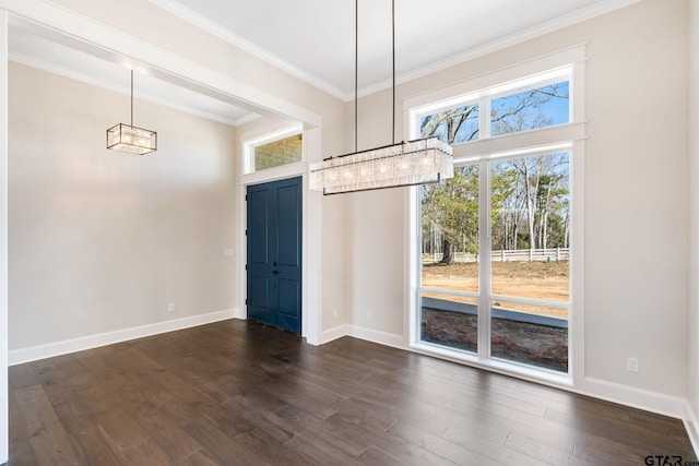 unfurnished dining area featuring ornamental molding and dark hardwood / wood-style floors