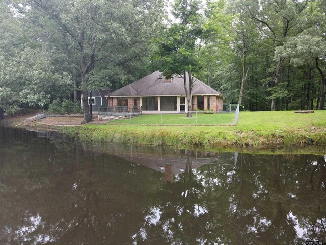 414 Winding Ln, Mount Vernon, TX 75457 - rear view of property with a wooded view and a water view