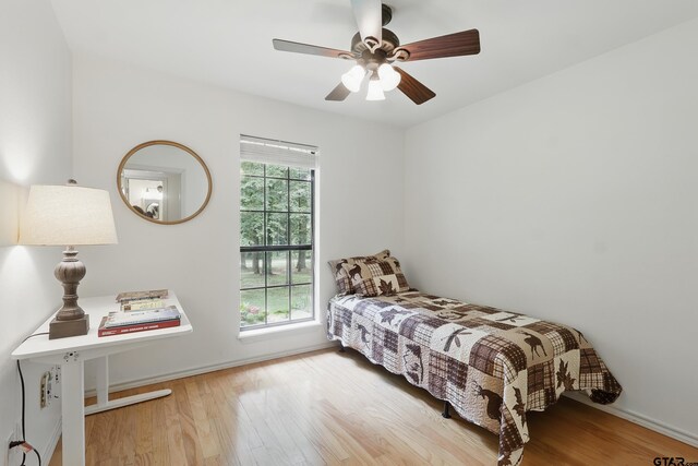 414 Winding Ln, Mount Vernon, TX 75457 - bedroom with wood finished floors and a ceiling fan