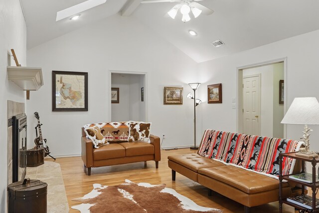 414 Winding Ln, Mount Vernon, TX 75457 - living room with beam ceiling, light wood-type flooring, ceiling fan, high vaulted ceiling, and a skylight