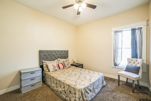 bedroom with a ceiling fan, baseboards, and carpet flooring