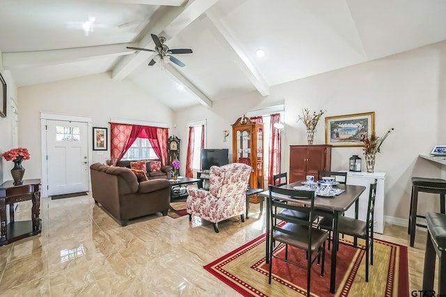 living room featuring lofted ceiling with beams, marble finish floor, ceiling fan, and baseboards