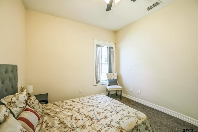 bedroom featuring baseboards, visible vents, dark carpet, and a ceiling fan