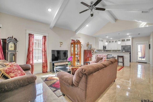 living room with visible vents, baseboards, ceiling fan, vaulted ceiling with beams, and marble finish floor