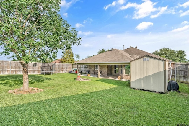 10820 Cactus Trl, Flint, TX 75762 - fenced backyard featuring a trampoline, a patio, and a shed