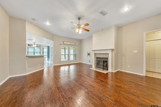 10820 Cactus Trl, Flint, TX 75762 - unfurnished living room featuring a ceiling fan, wood finished floors, a fireplace, and recessed lighting