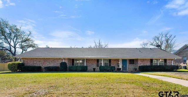 single story home with brick siding and a front lawn