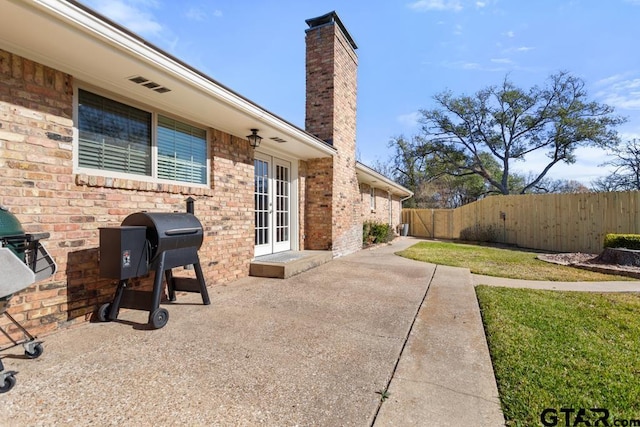 view of patio / terrace with area for grilling and french doors