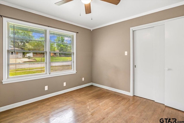 2216 Pleasent Dr, Tyler, TX 75701 - empty room with plenty of natural light, ceiling fan, wood finished floors, and crown molding