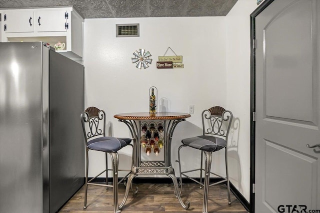2216 Pleasent Dr, Tyler, TX 75701 - dining space with wood finished floors and baseboards