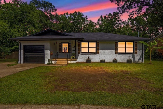 2216 Pleasent Dr, Tyler, TX 75701 - ranch-style house featuring concrete driveway, a garage, a front lawn, and brick siding