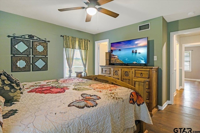 2216 Pleasent Dr, Tyler, TX 75701 - bedroom with wood finished floors, multiple windows, and a ceiling fan
