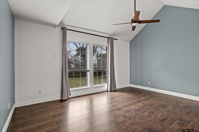 unfurnished room featuring lofted ceiling, ceiling fan, baseboards, and dark wood-type flooring