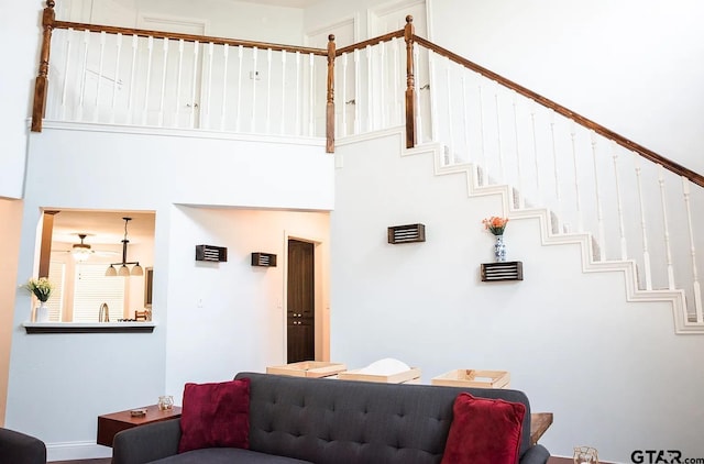 living room featuring a high ceiling