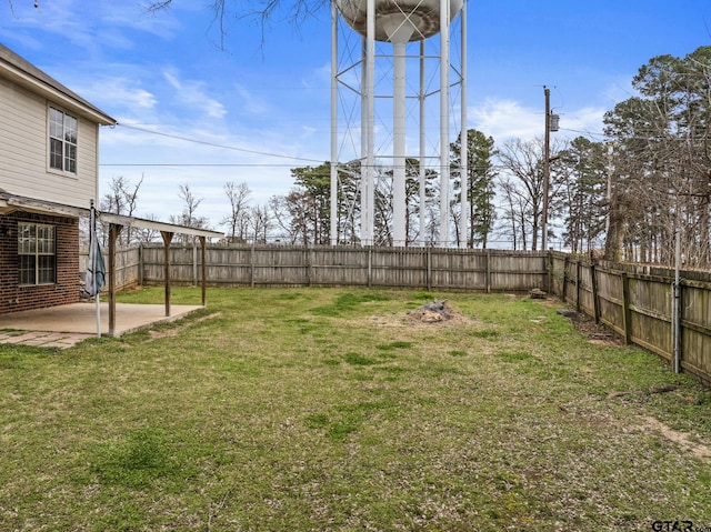 view of yard with a fenced backyard and a patio