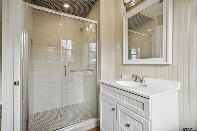 bathroom featuring vanity and an enclosed shower