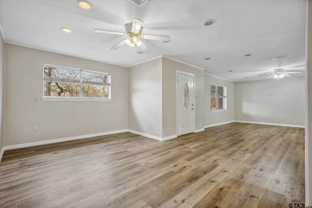 unfurnished room featuring ceiling fan, ornamental molding, and light hardwood / wood-style floors