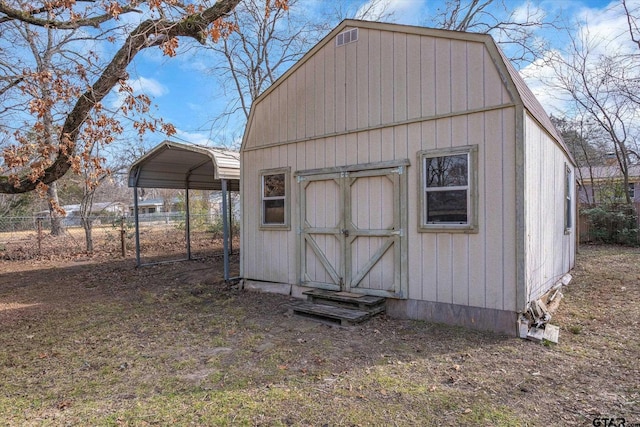 view of outbuilding with a carport