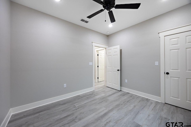 unfurnished bedroom featuring ceiling fan and light hardwood / wood-style floors