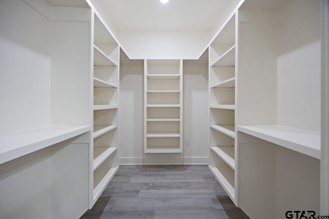 walk in closet featuring hardwood / wood-style floors