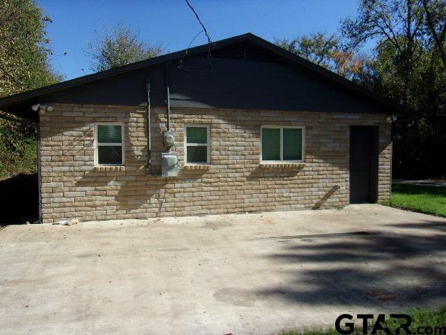 view of home's exterior with brick siding