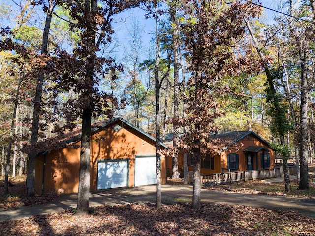 view of front of home featuring a garage and a porch