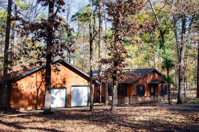 view of front of house with a garage and covered porch