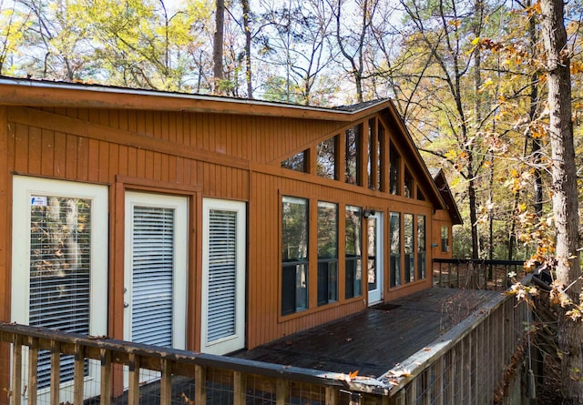 view of home's exterior with a wooden deck