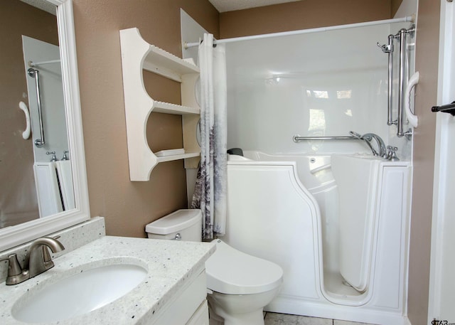 bathroom with vanity and toilet