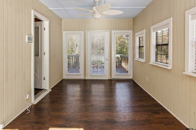 interior space with ceiling fan