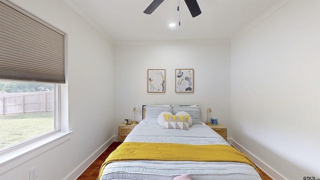 bedroom featuring ceiling fan, crown molding, baseboards, dark wood-style floors, and recessed lighting