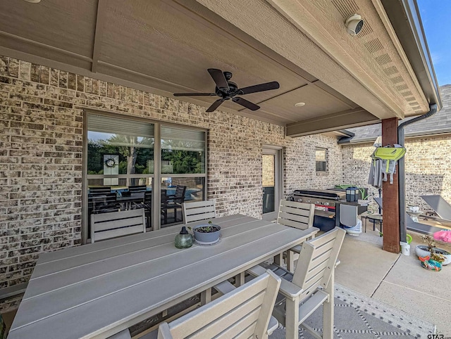 view of patio / terrace with a ceiling fan and outdoor dining area