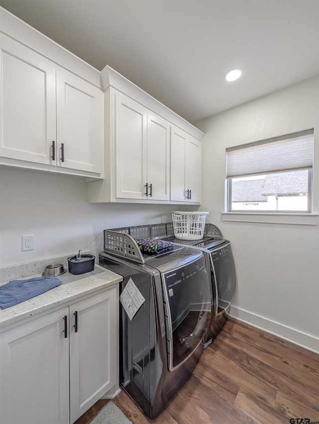 laundry room with washer and dryer, baseboards, dark wood-style floors, recessed lighting, and cabinet space