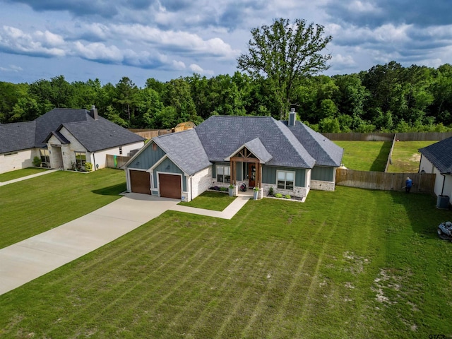 view of front of house with a front lawn, board and batten siding, and driveway