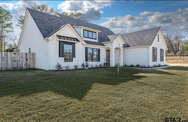 view of front of property with a front lawn