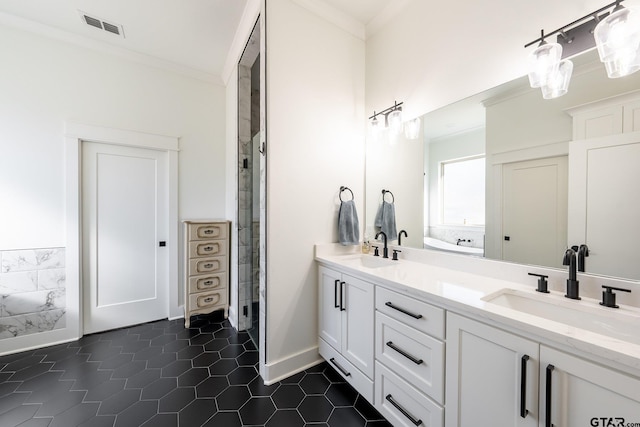 bathroom with a shower with shower door, tile patterned flooring, vanity, and crown molding