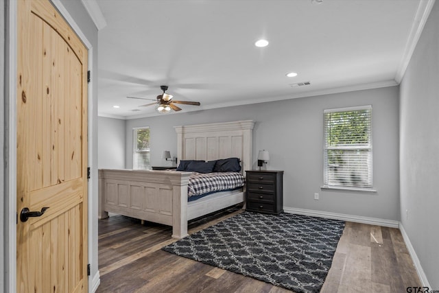 bedroom featuring ornamental molding, dark hardwood / wood-style floors, and ceiling fan