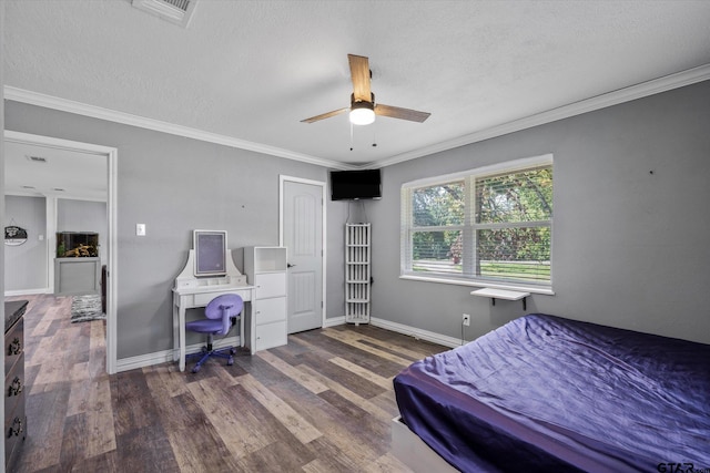 bedroom featuring ornamental molding, a textured ceiling, dark wood-type flooring, and ceiling fan