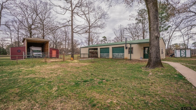 view of yard with a shed and a carport