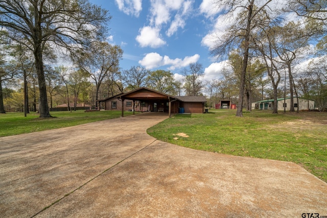 view of front facade featuring a carport and a front lawn