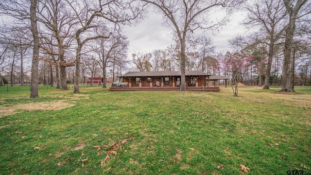 view of yard featuring a wooden deck