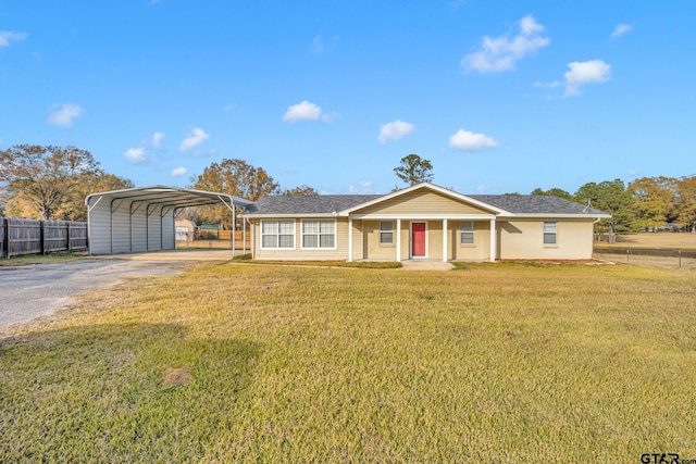 ranch-style house with a front lawn and a carport