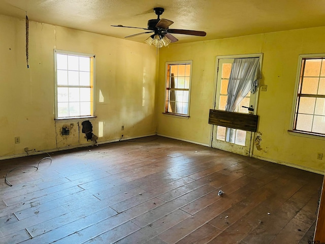 unfurnished room featuring hardwood / wood-style flooring and ceiling fan